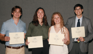 During UMW's 25th annual Summer Science Institute, several students earned awards from the John C. and Jerri Barden Perkins '61 College of Arts and Sciences Student Research Endowment, which will provide funding for them to continue their research during the academic year. From left: Boone Fleenor '26 (second place, poster), Morgan Hicok '25 (first place, oral presentation), Kate Green '25 (first place, poster) and Joseph Gasink '26 (second place, oral presentation). Photo by Karen Pearlman.